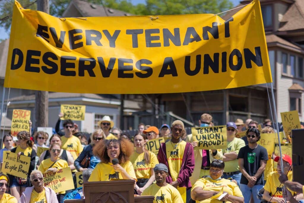 Maya Neal of KC Tenants leads a cheering crowd