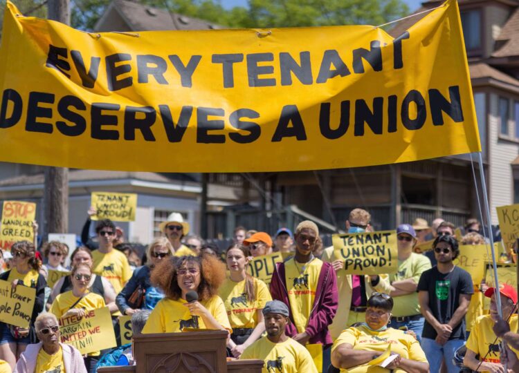 Maya Neal of KC Tenants leads a cheering crowd