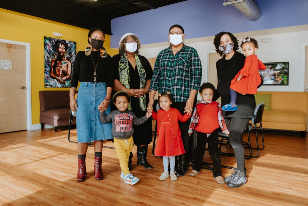 Doulas and Black Mothers of Kansas City with their children at Uzazi Village.